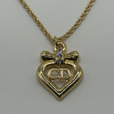 DIOR GOLD CD HEART RIBBON NECKLACE